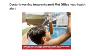 young boy pouring water over head during heatwave 